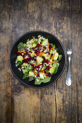 Bowl of autumnal salad with lettuce, carrots, avocado, beetroot, pumpkin and sunflower seeds, pomegranate and quinoa - LVF05488