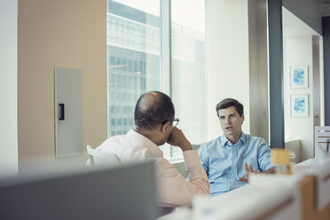 Two businessmen talking together in office - WESTF21823