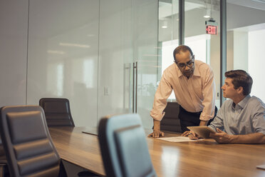 Two businessmen working together in office - WESTF21836