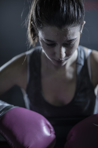 Female boxer looking down stock photo