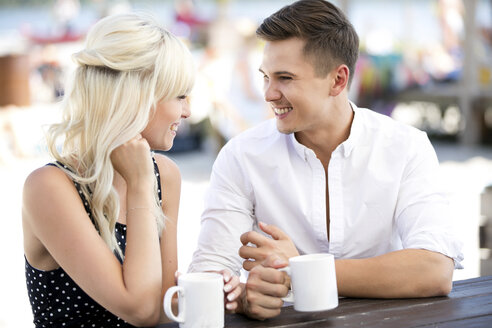 Couple sitting together at outdoor cafe - GDF01166