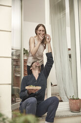 Happy couple sharing a pizza - SUF00132