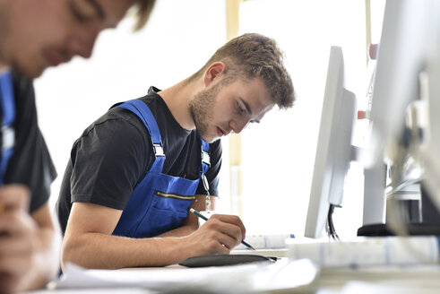 Vocational school students writing a test - LYF00648