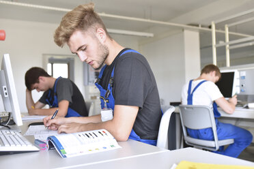 Vocational school students writing a test - LYF00650