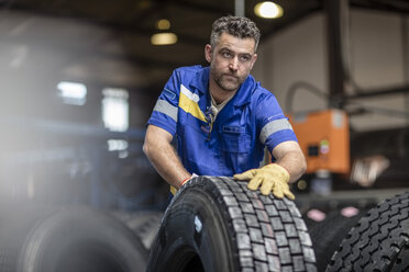 Repairman working in tire factory - ZEF11189