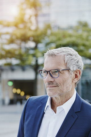 Confident businessman outdoors stock photo