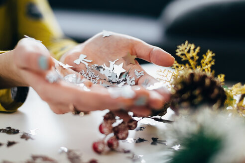 Woman's hands holding Christmas decor - LCUF00073