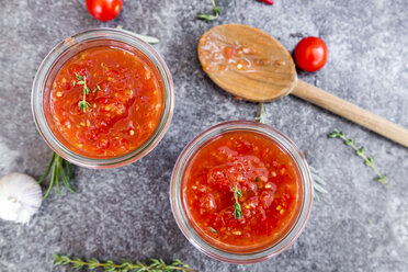 Two glasses of homemade tomato sauce on stone - SARF03041