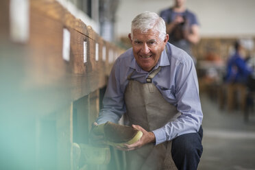 Portrait of smiling shoemaker in workshop - ZEF11323