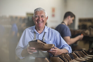 Portrait of smiling shoemaker in workshop - ZEF11327