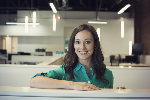 Young woman working in office, portrait stock photo