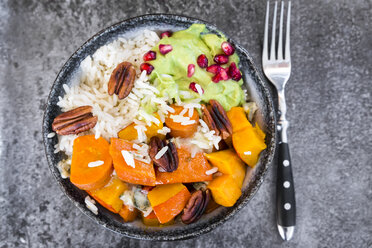 Bowl of autumnal salad with carrots, pumpkin, sweet potatoes, pecan, guacamole, pomegranate and rice - SARF03057