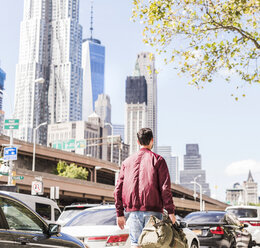 USA, New York City, back view of man in Manhattan - UUF09150