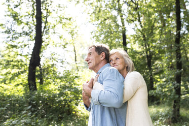 Happy senior couple relaxing together in the woods - HAPF01051