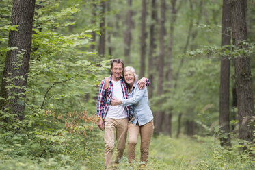 Happy senior couple walking in the woods - HAPF01080