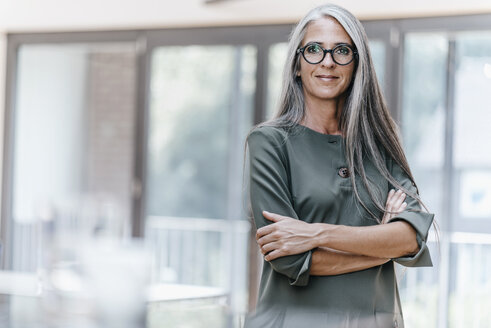 Portrait of smiling woman with long grey hair - KNSF00542