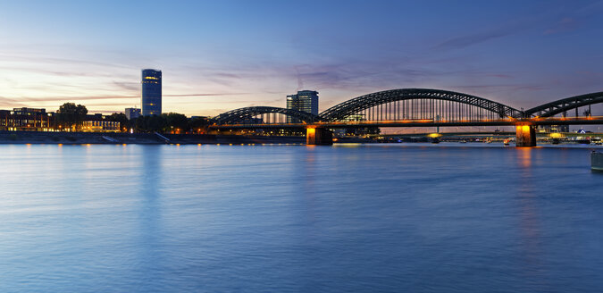 Germany, Cologne, view to KoelnTriangle and Hohenzollern Bridge at evening twilight - GFF00875