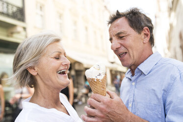 Happy senior couple with ice cream cone - HAPF01116