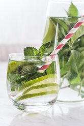 Glass and carafe of detox water with mint and limes - SBDF03065