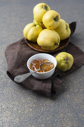 Wooden bowl of quinces and bowl of quince jelly - MYF01853