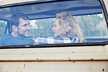 Smiling couple in pick up truck - FMKF03200