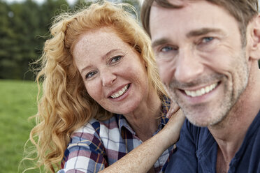 Portrait of smiling couple outdoors - FMKF03208