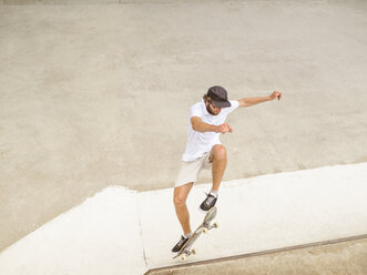 Young man skate boarding in skate park - LAF01806