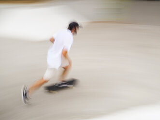 Young man skate boarding in skate park - LAF01808