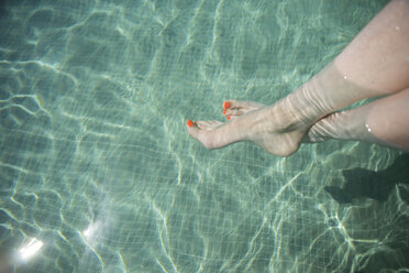 Female feet in swimming pool - CHPF00330