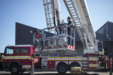 Mechanics maintaining fire engine - ZEF11699