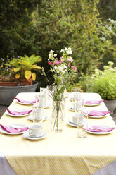 Laid table in garden, decorated for a birthday party - MFRF00726