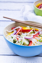 Bowl of glass noodle salad with vegetables on wood - LVF05617