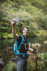 Hiker taking a selfie in nature - RAEF01548