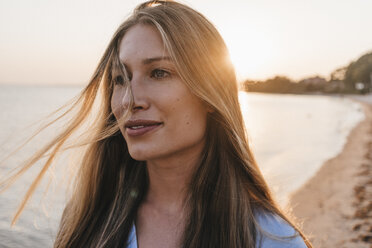 Portrait of young woman on the at sunset - KNSF00702