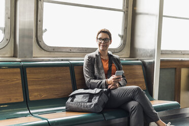 Businesswoman on a ferry - UU09333