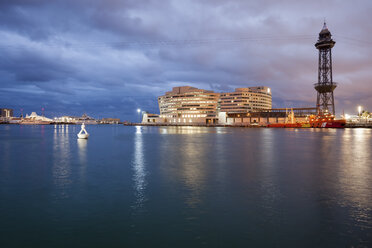 Spain, Barcelona, view to port at duskwith Torre Jaume I of cable car - ABO00114