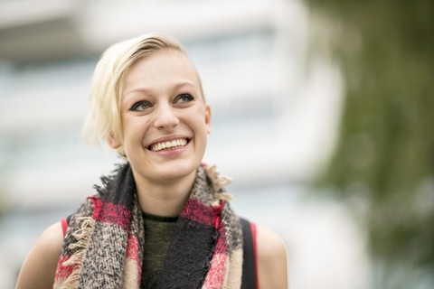 Portrait of smiling blonde woman with scarf stock photo