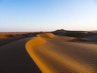 Oman, Al Raka, dunes in Rimal Al Wahiba desert at sunset - AMF05108