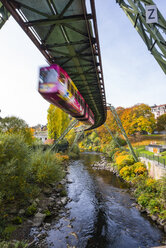 Germany, Wuppertal, driving overhead railway in autumn - WG01004