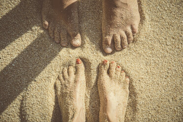Feet of a couple standing in the sand seen from above - CHPF00352