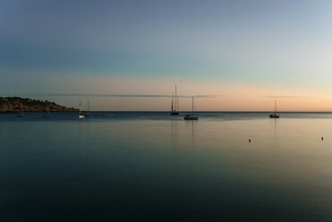 Spian, Ibiza, Sa Caixota Beach with sailing boats at sunset - KIJF01037