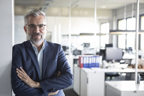 Portrait of confident businessman in office - RBF05291