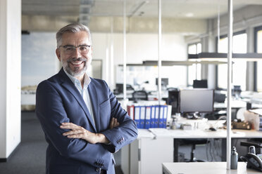 Portrait of confident businessman in office - RBF05293