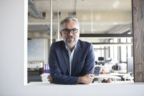 Portrait of confident businessman in office - RBF05299