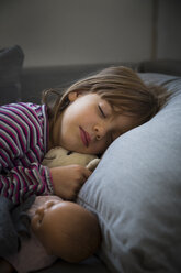 Portrait of little girl sleeping on couch - LVF05648