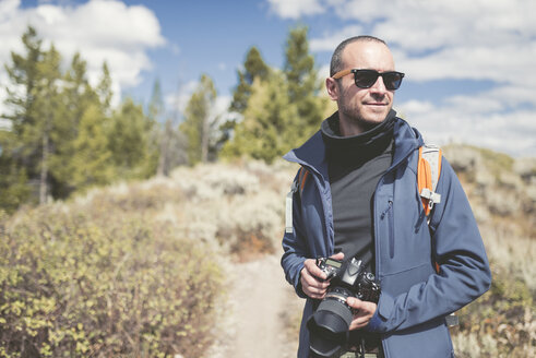 USA, Wyoming, man with camera at Grand Teton National Park - EPF00190