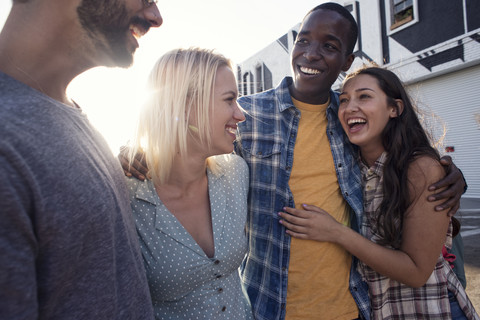 Two happy young couples outdoors on the go stock photo