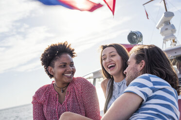 Happy friends on a boat trip - WESTF22240