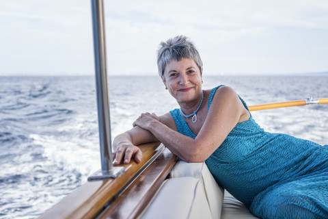 Smiling woman on a boat trip stock photo