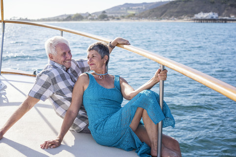 Happy couple on a boat trip stock photo